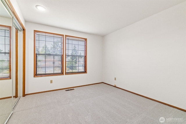 5040 Mill Pond Loop SE, Auburn, WA 98092 - empty room with plenty of natural light and light carpet