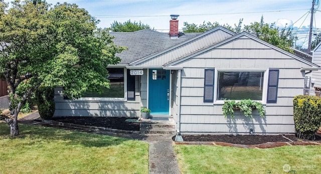 7014 S Fife St, Tacoma, WA 98409 - view of front of home with a front lawn, a chimney, and roof with shingles