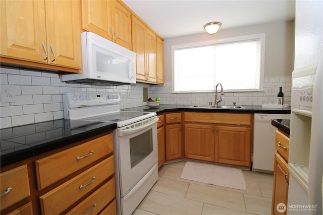 7014 S Fife St, Tacoma, WA 98409 - kitchen featuring white appliances, decorative backsplash, and light tile patterned flooring