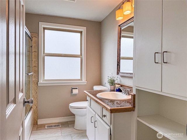 7014 S Fife St, Tacoma, WA 98409 - bathroom featuring vanity, plenty of natural light, and bath / shower combo with glass door