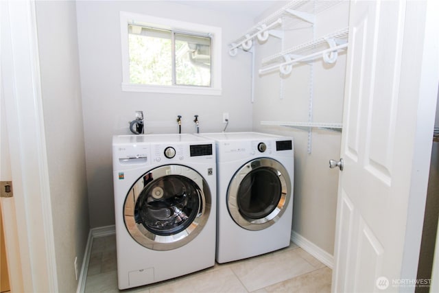 7014 S Fife St, Tacoma, WA 98409 - laundry area with washer and dryer and light tile patterned floors