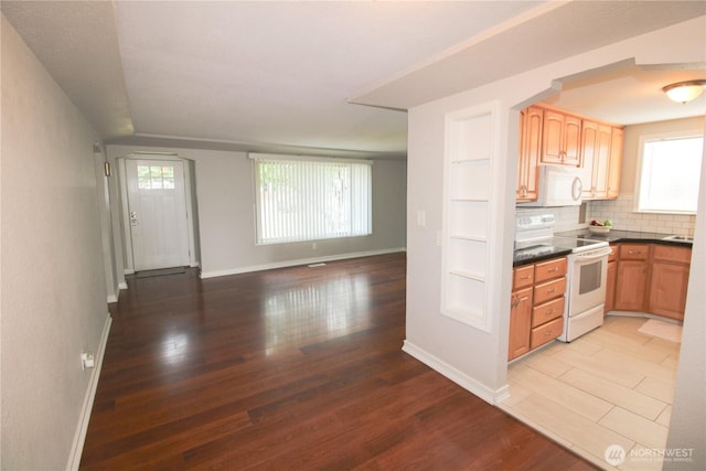 7014 S Fife St, Tacoma, WA 98409 - kitchen with white appliances, light wood finished floors, healthy amount of natural light, and open floor plan
