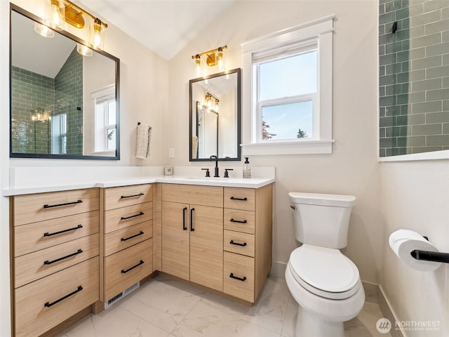 724 6th Ave SW, Puyallup, WA 98371 - full bathroom with lofted ceiling, marble finish floors, healthy amount of natural light, vanity, and tiled shower