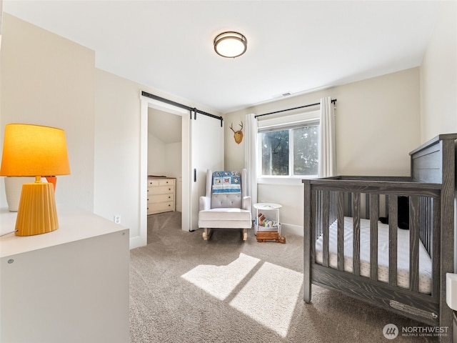 724 6th Ave SW, Puyallup, WA 98371 - carpeted bedroom featuring a barn door and baseboards