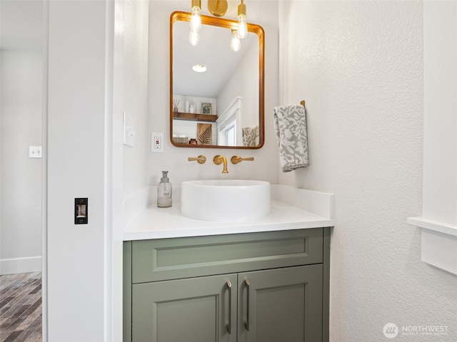 724 6th Ave SW, Puyallup, WA 98371 - bathroom featuring vanity and wood finished floors