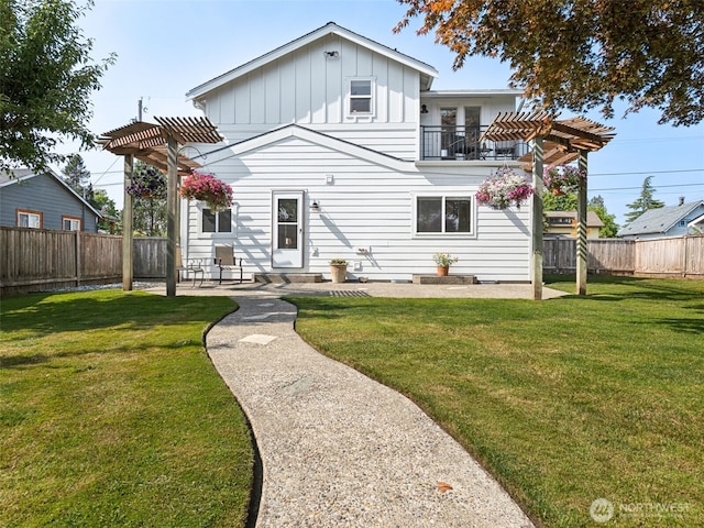 724 6th Ave SW, Puyallup, WA 98371 - view of front of property featuring a pergola, board and batten siding, a balcony, and a fenced backyard