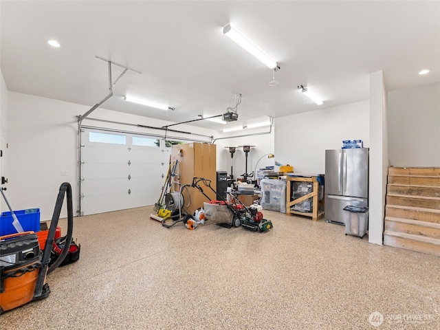 724 6th Ave SW, Puyallup, WA 98371 - garage featuring freestanding refrigerator, a garage door opener, and recessed lighting