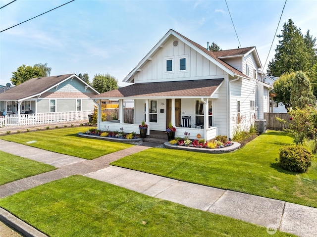 724 6th Ave SW, Puyallup, WA 98371 - view of front of home featuring board and batten siding, a porch, and a shingled roof