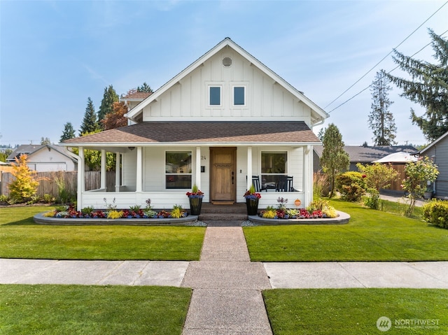 724 6th Ave SW, Puyallup, WA 98371 - view of front of house with board and batten siding, roof with shingles, and a porch