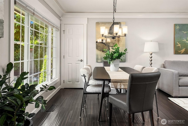 1321 Kossuth Ave, Everett, WA 98203 - dining room with a chandelier, plenty of natural light, and dark wood-style floors
