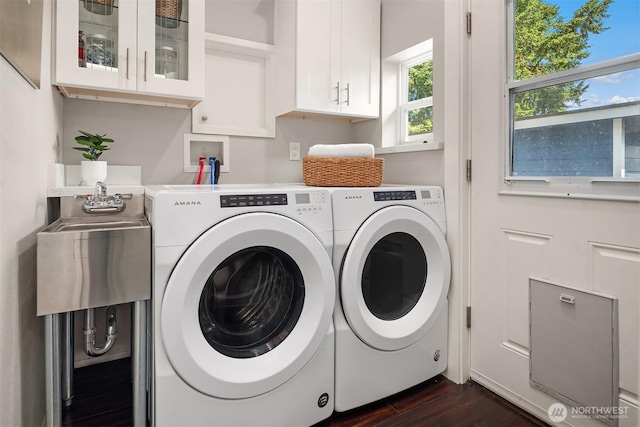 1321 Kossuth Ave, Everett, WA 98203 - laundry room with washer and clothes dryer, cabinet space, and dark wood finished floors