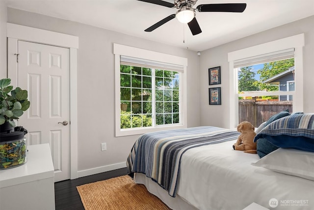 1321 Kossuth Ave, Everett, WA 98203 - bedroom featuring multiple windows, dark wood-style flooring, and a ceiling fan
