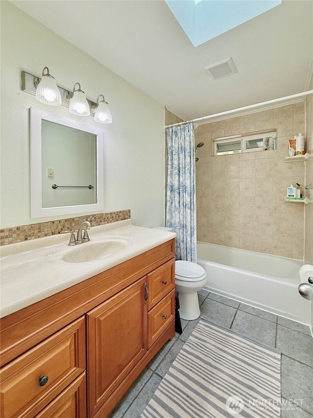 11422 Leschi Cir, Anderson Island, WA 98303 - full bathroom with vanity, tile patterned floors, shower / tub combo, and a skylight