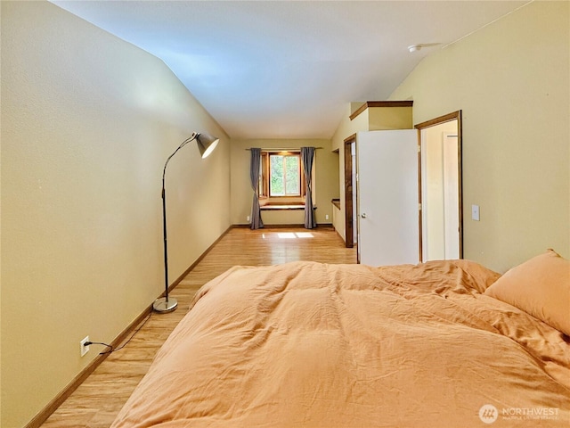 11422 Leschi Cir, Anderson Island, WA 98303 - bedroom featuring vaulted ceiling and light wood-type flooring