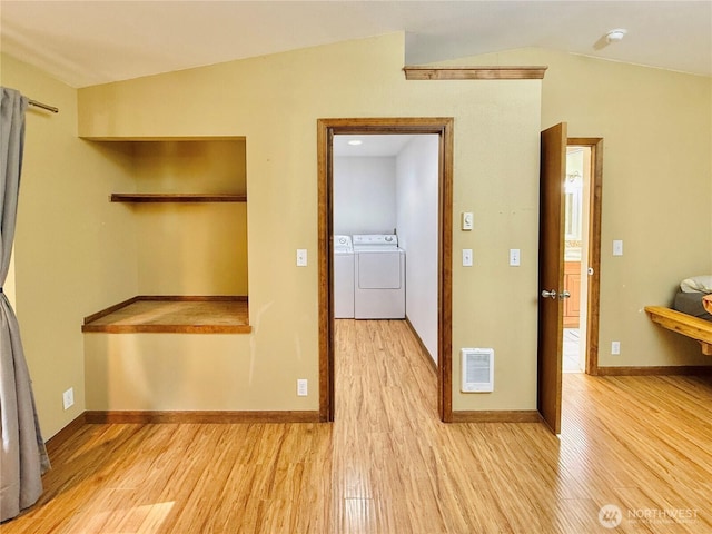 11422 Leschi Cir, Anderson Island, WA 98303 - empty room featuring independent washer and dryer, light wood-type flooring, heating unit, and a smoke detector