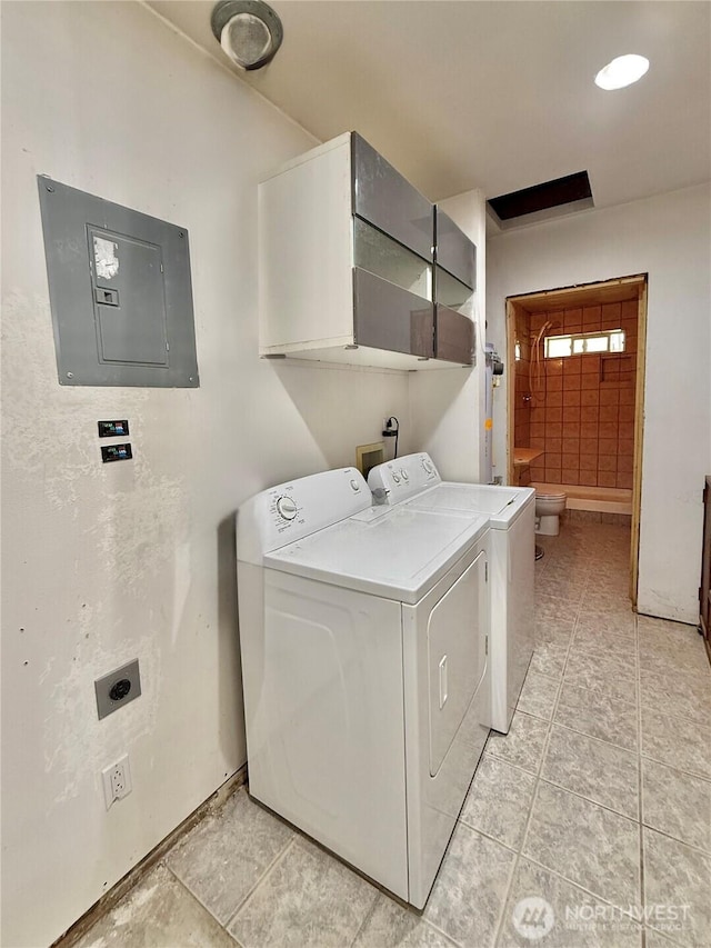 11422 Leschi Cir, Anderson Island, WA 98303 - laundry area with electric panel, independent washer and dryer, and light tile patterned flooring