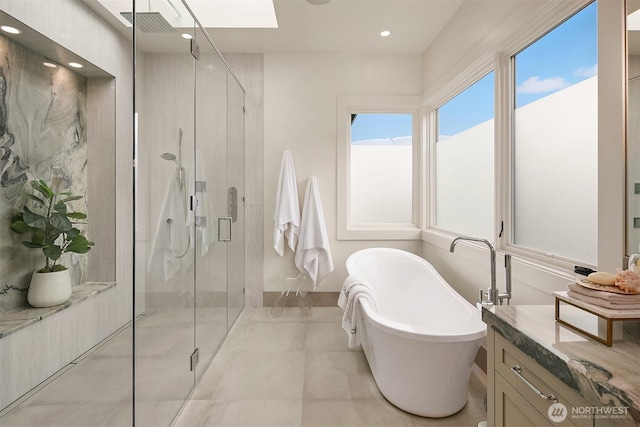 1918 94th Ave NE, Clyde Hill, WA 98004 - bathroom with a stall shower, a freestanding bath, vanity, recessed lighting, and a skylight
