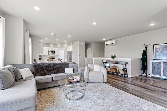 1575 Kingsley Ave, Blaine, WA 98230 - living area with a wall mounted AC, dark wood-style flooring, and recessed lighting
