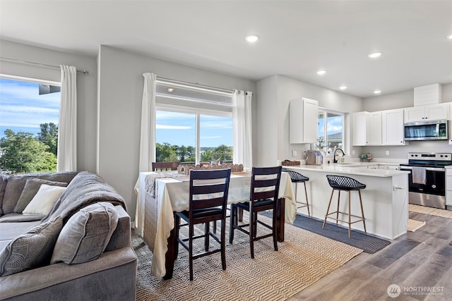1575 Kingsley Ave, Blaine, WA 98230 - dining space with healthy amount of natural light, recessed lighting, and wood finished floors