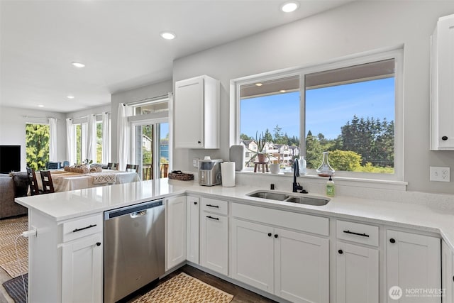 1575 Kingsley Ave, Blaine, WA 98230 - kitchen featuring stainless steel dishwasher, a peninsula, white cabinets, light countertops, and recessed lighting