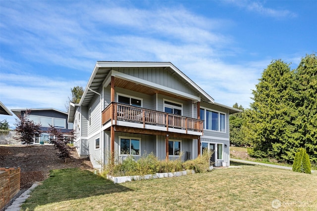 1575 Kingsley Ave, Blaine, WA 98230 - rear view of property with board and batten siding and a yard