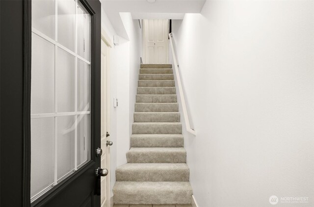 18223 NE 95th Way Unit 102, Redmond, WA 98052 - stairs featuring baseboards