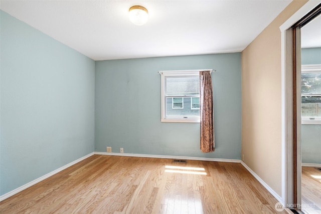 406 4th St NE, Puyallup, WA 98372 - empty room featuring wood finished floors and baseboards