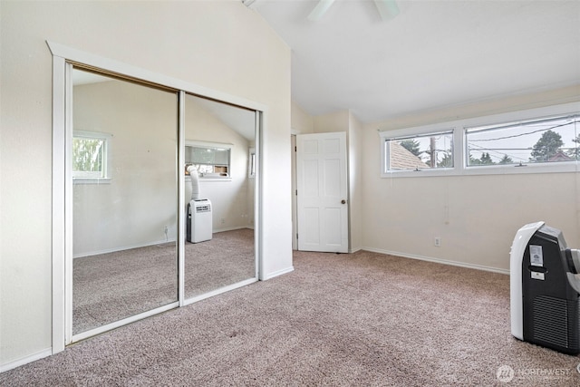 406 4th St NE, Puyallup, WA 98372 - bedroom featuring carpet floors, lofted ceiling, a closet, and ceiling fan