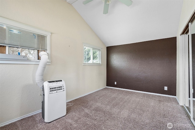 406 4th St NE, Puyallup, WA 98372 - unfurnished bedroom with carpet floors, vaulted ceiling, and ceiling fan