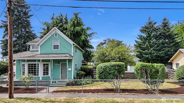 406 4th St NE, Puyallup, WA 98372 - view of front of house featuring covered porch, a fenced front yard, and a gate