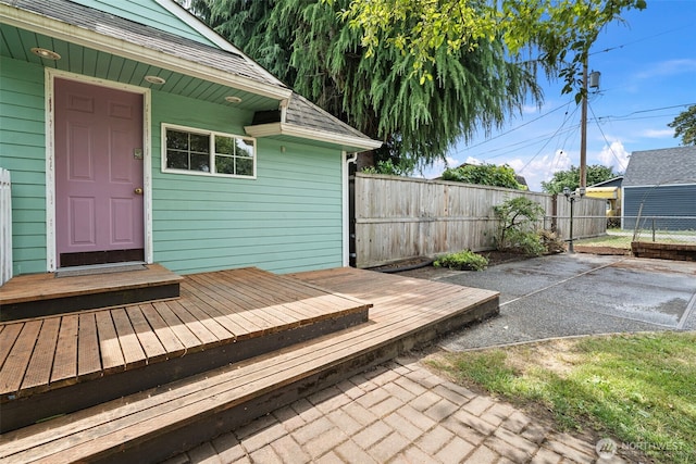 406 4th St NE, Puyallup, WA 98372 - wooden deck featuring a fenced backyard and a patio