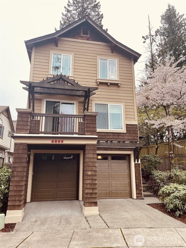 6802 156th Pl NE, Redmond, WA 98052 - view of front of property with an attached garage, driveway, a balcony, and a pergola
