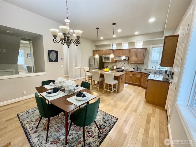 6802 156th Pl NE, Redmond, WA 98052 - dining area with light wood finished floors, a chandelier, and recessed lighting