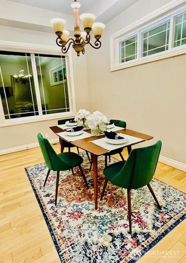6802 156th Pl NE, Redmond, WA 98052 - dining area featuring a chandelier and wood finished floors