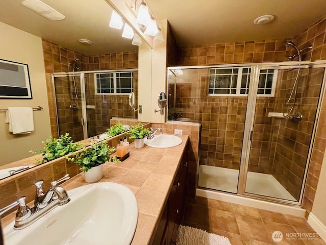 6802 156th Pl NE, Redmond, WA 98052 - bathroom with a stall shower, double vanity, decorative backsplash, and tile patterned floors