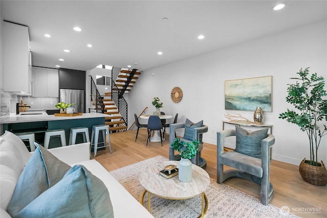 2009B Dexter Ave N, Seattle, WA 98109 - living room with stairs, recessed lighting, and light wood-style flooring