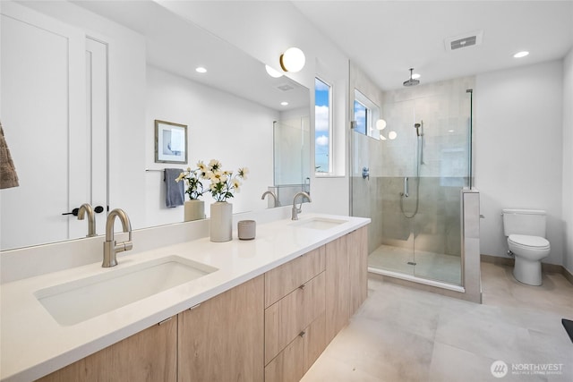 2009B Dexter Ave N, Seattle, WA 98109 - bathroom with a shower stall, double vanity, recessed lighting, and tile patterned flooring