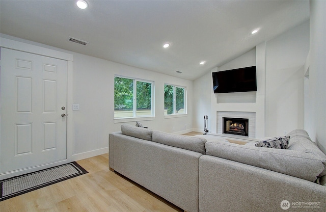 1611 NE 113th St Unit 421, Vancouver, WA 98686 - living area with light wood-style flooring, a lit fireplace, recessed lighting, and vaulted ceiling