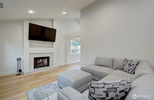 1611 NE 113th St Unit 421, Vancouver, WA 98686 - living area with light wood finished floors, recessed lighting, a lit fireplace, and high vaulted ceiling