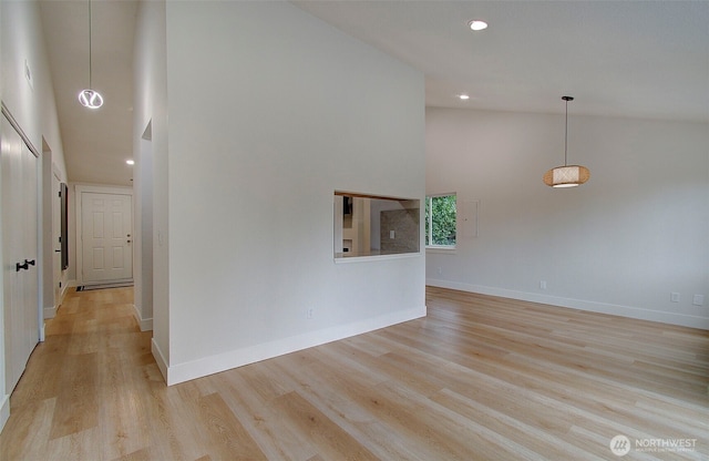 1611 NE 113th St Unit 421, Vancouver, WA 98686 - unfurnished living room featuring high vaulted ceiling, light wood-style flooring, and recessed lighting