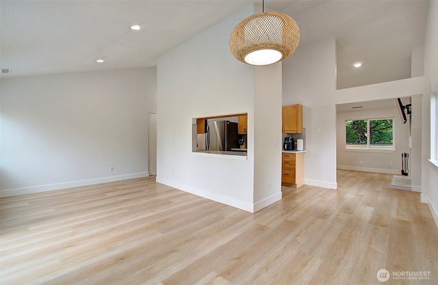1611 NE 113th St Unit 421, Vancouver, WA 98686 - unfurnished living room with a high ceiling, light wood-type flooring, and recessed lighting