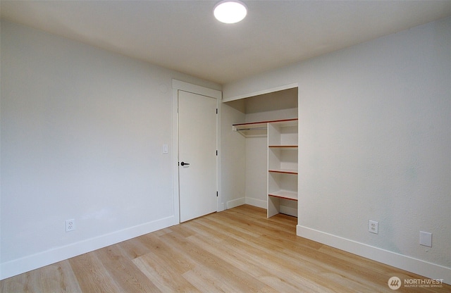 1611 NE 113th St Unit 421, Vancouver, WA 98686 - unfurnished bedroom with light wood-type flooring and a closet