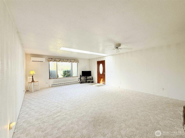 4905 US Highway 12, Elma, WA 98541 - unfurnished living room featuring an AC wall unit, carpet, a textured ceiling, a baseboard heating unit, and a ceiling fan