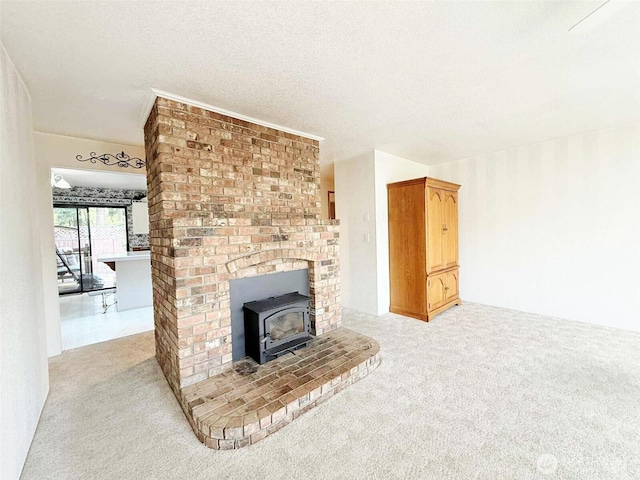 4905 US Highway 12, Elma, WA 98541 - unfurnished living room featuring light colored carpet and a wood stove