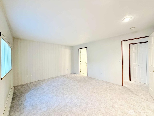 4905 US Highway 12, Elma, WA 98541 - carpeted spare room with a baseboard heating unit and a smoke detector