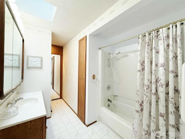 4905 US Highway 12, Elma, WA 98541 - bathroom featuring vanity, shower / tub combo with curtain, a textured ceiling, a skylight, and tile patterned flooring