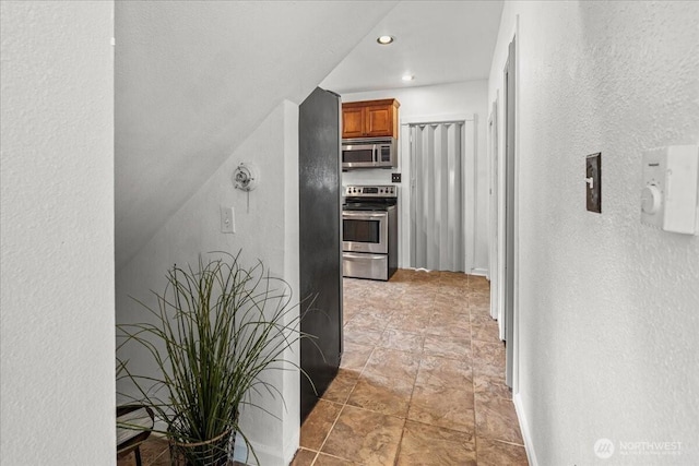 820 S Ferry St, Tacoma, WA 98405 - corridor with a textured wall and recessed lighting