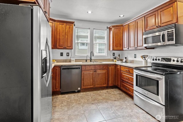 820 S Ferry St, Tacoma, WA 98405 - kitchen featuring stainless steel appliances, light countertops, brown cabinetry, and recessed lighting