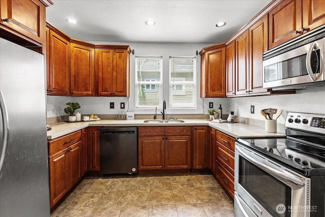 820 S Ferry St, Tacoma, WA 98405 - kitchen featuring appliances with stainless steel finishes, light countertops, recessed lighting, and brown cabinets