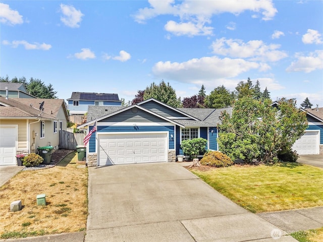 839 Avalon Ct SE, Olympia, WA 98513 - view of front of property with stone siding, concrete driveway, an attached garage, and a shingled roof